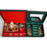 Costume jewellery in two boxes, together with a silver napkin ring.