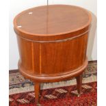 An Edwardian oval cross banded mahogany cellarette, in regency style,