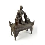 An impressive Japanese bronze tableau with three figures on a bronze table stand, width 34cm,