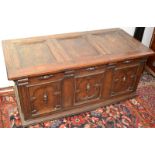 A 17th century oak joined chest, the lid and front each with three panels, width 133cm, height 61cm.