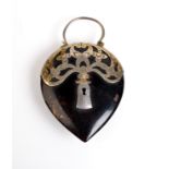 A tortoiseshell and chased silver gilt mounted 19th century padlock.