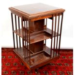 A cross banded Edwardian revolving bookcase. Condition Report: The height is 85cm.