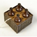 A 19th century bronze inkwell cast as a basket, the lid as four wine jars, lifting to reveal a glass