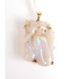 A 14ct., gold carved opal pendent in Chinese style.