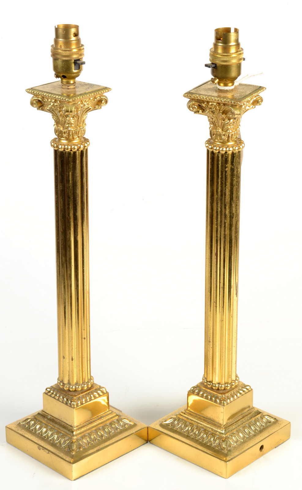 A pair of brass classical column table lamps.