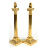 A pair of brass classical column table lamps.