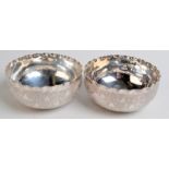 A pair Eastern silver coloured metal bowls finely engraved with a repeating leaf motif, unmarked,