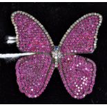 A gold mounted butterfly brooch retailed by Le Cheminant & Co.