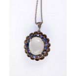 A moonstone and sapphire pendant, with chain.