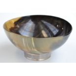 A modern faux-tortoiseshell bowl with silver band to the base by M. & A. Co.