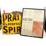 A framed display of late 19th and early 20th century GWR timetables together with a Pratts spirit