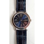 A gentleman's Piaget 18ct. white gold wrist watch with blue dial and blue Piaget leather strap.