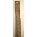 A medieval oak door pillar carved heavily with lizards and monkeys amid vines,