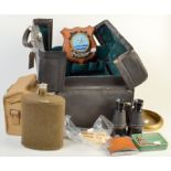 A black Gladstone bag, a pair of Second World War binoculars etc.