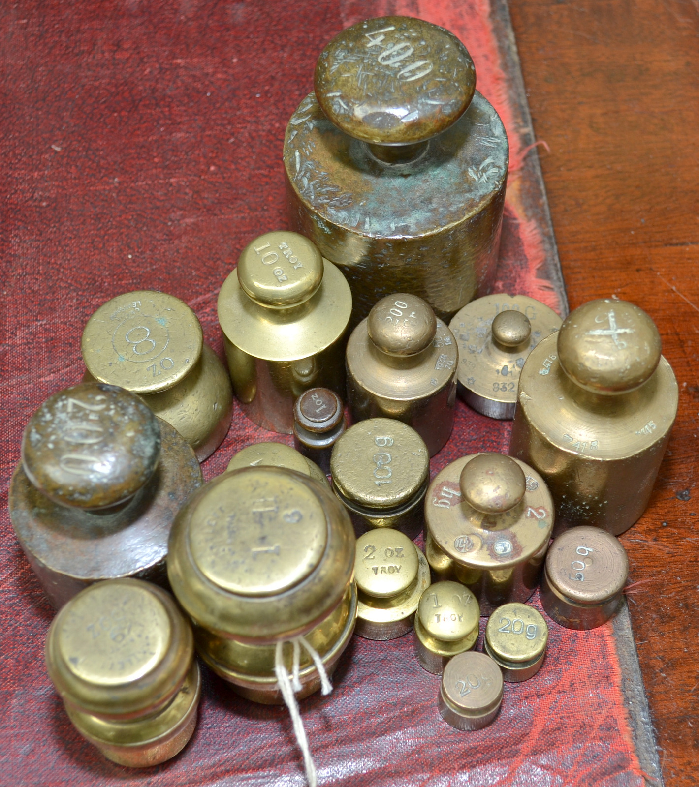 Various cylindrical and other brass weights.