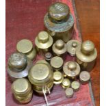 Various cylindrical and other brass weights.