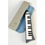 A Hohner, German, grey metal and plastic Melodica Piano 26, original case.