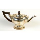 An Edwardian silver bachelors' pedestal teapot, by Thomas Bradbury & Sons, London, 1902, 14oz.
