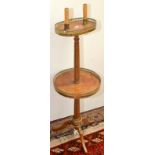 A two tiered tripod occasional table, with a pair of bulb holders.