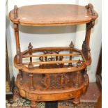 A good Victorian oval section figured walnut veneered, two tier Canterbury,