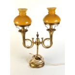 A brass electric table lamp with twin "Bugle" branches and a cloisonne vase.