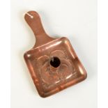 A Newlyn copper chamber stick decorated with four fish, impressed mark.