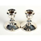 A pair of George V silver dwarf candlesticks by G. Unite & Sons & Lyde Ltd.
