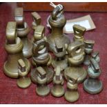 Various small bell shaped brass weights.