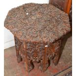 An eastern octagonal coffee table with folding stand.