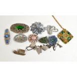 A collection of large costume jewellery brooches etc.