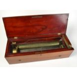 A Swiss brass cylinder music box, the intact comb marked LF GVE in an inlaid mahogany box, width