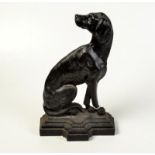 An iron doorstop cast as a seated dog looking backwards, height 37cm. Condition Report: No