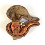 A meerschaum pipe the bowl held by a carved eagle's claw, fitted case. Condition Report: Signs of