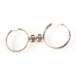 A pair of 18ct. white gold diamond hoop earrings.