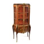 A French vitrine with ormolu mounts and Vernis Martin panels in Louis XV chased and of Bombay form,