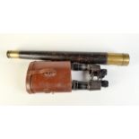 A Victorian leather covered brass single drawer telescope and a pair of Goliath binoculars in