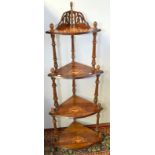 A Victorian walnut and marquetry, four tier corner whatnot.