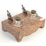 A Scottish pink granite early 19th century ink stand with a pair of moulded glass,