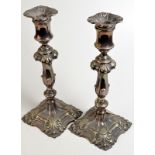 A pair of silver plated (AND NOT hallmarked silver) candlesticks, each 32.5cm.