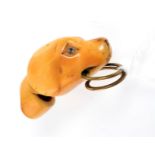 An antique ivory dog head whistle.