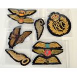 A collection of cloth flying badges, including R.F.C., B.I.A. and B.A.F.