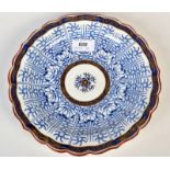 A late 18th century Worcester 'Royal Lily' pattern plate with a gilt border and central ring,