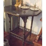 A Victorian ebonised and parcel gilt occasional table.