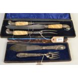 A good three piece 19th century carving set with ivory handles, cased and a pair of fish servers,