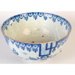 An 18th century English Delft blue and white bowl, damaged and repaired, diameter 29.5cm.