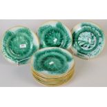 A set of eleven majolica basket and leaf moulded plates, each diameter 22.5cm. Condition Report: