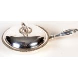 A dragooned warming dish and cover by Mappin & Webb with detachable handle.