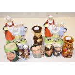 Three small Royal Doulton character jugs, Robin Hood, Merlin and Sairey Gamp and four Toby jugs.