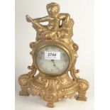 A 19th century French timepiece, in a gilt case, mounted with a cherub.