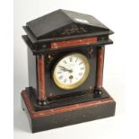 A 19th century mantle timepiece, by Mappin & Webb, in a black slate and red marble case.